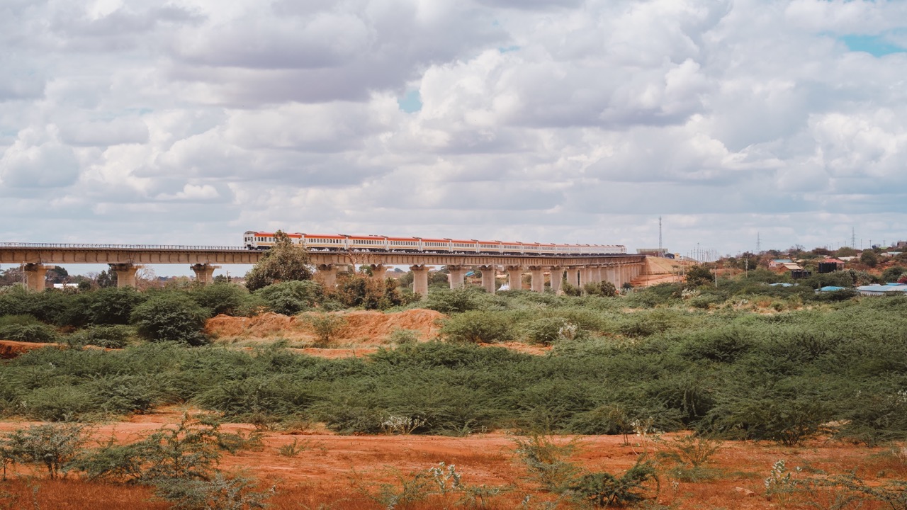 train-going-on-a-bridge-under-the-cloudy-sky-in-ts-2023-05-16-00-44-30-utc Large